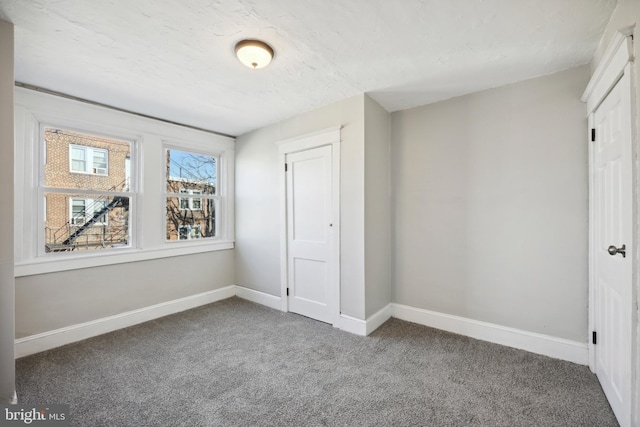 unfurnished bedroom with carpet floors