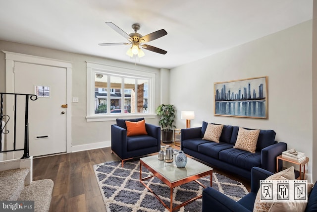 living room with ceiling fan and dark hardwood / wood-style floors