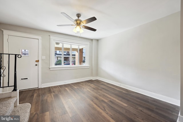 foyer with ceiling fan and dark hardwood / wood-style floors