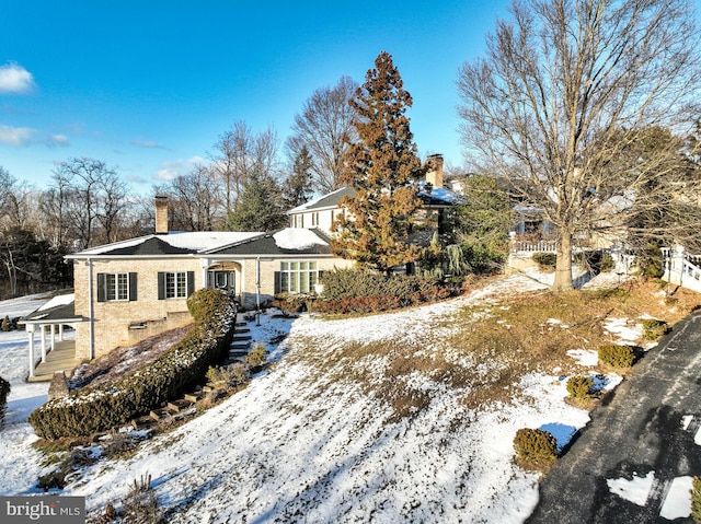 view of snow covered property