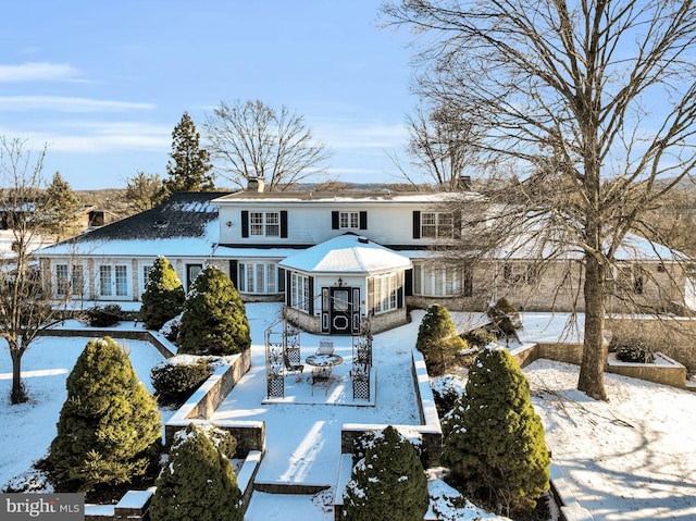 view of snow covered house