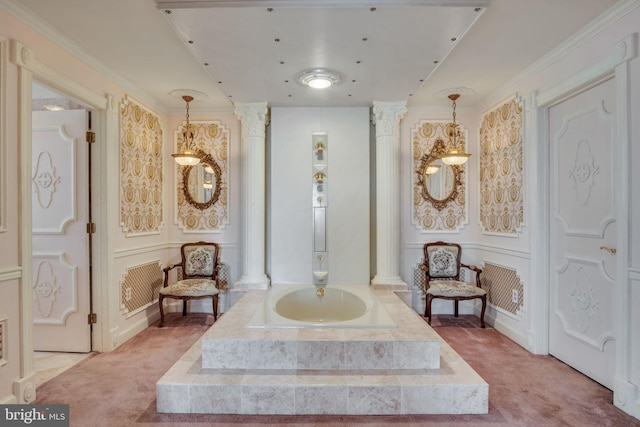 interior space featuring carpet floors, crown molding, and decorative columns