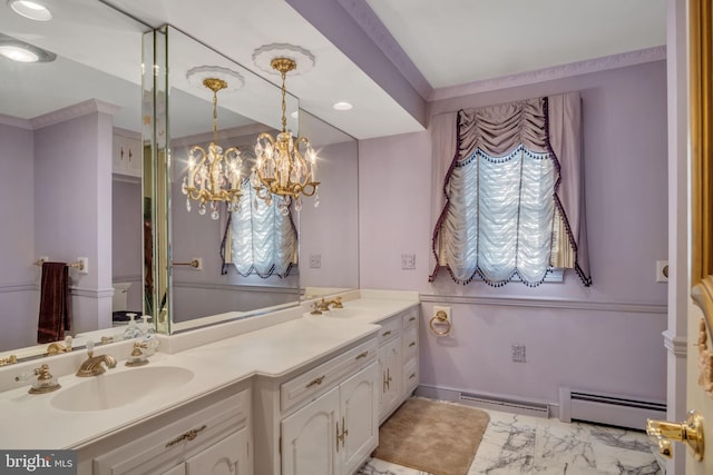 bathroom with vanity, a chandelier, and a baseboard radiator