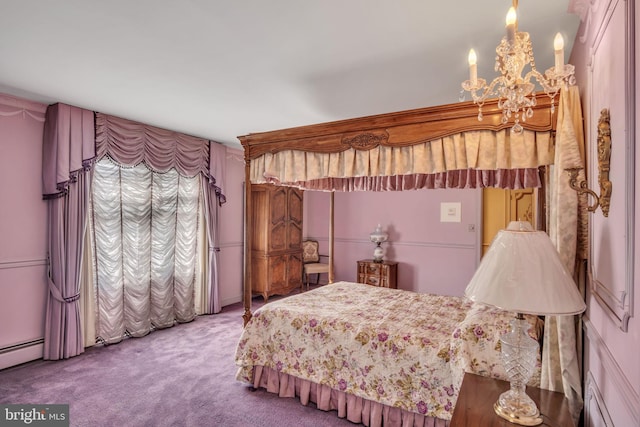 bedroom with carpet and a chandelier