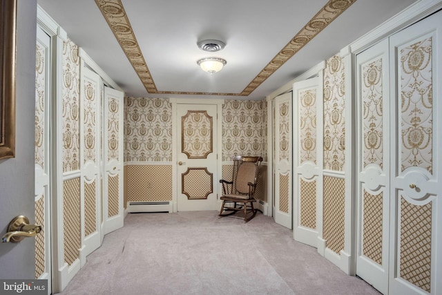 living area featuring a baseboard radiator and light colored carpet