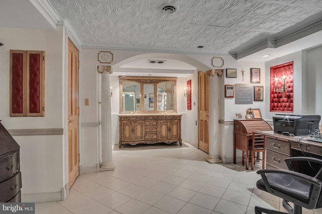 office space featuring light tile patterned floors, ornamental molding, and decorative columns