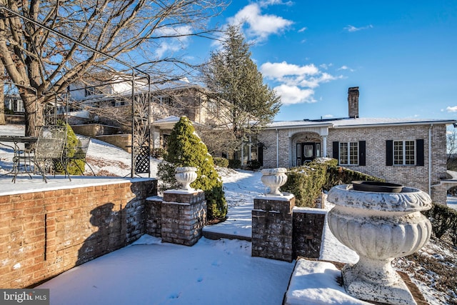 view of snow covered house