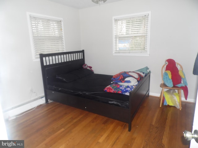 bedroom featuring dark hardwood / wood-style flooring