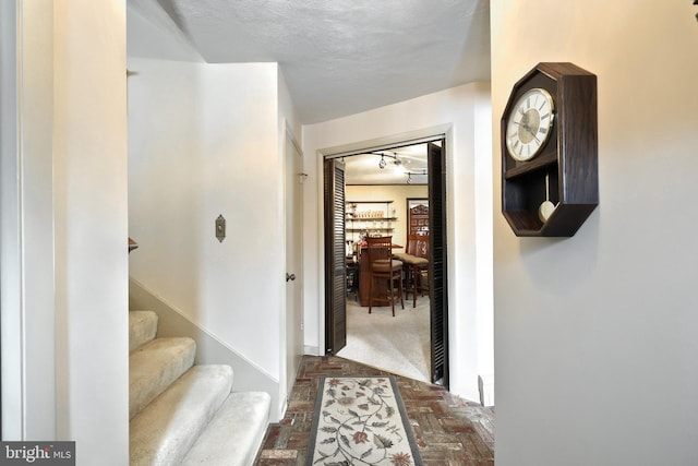 interior space with a textured ceiling