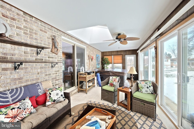 sunroom featuring ceiling fan