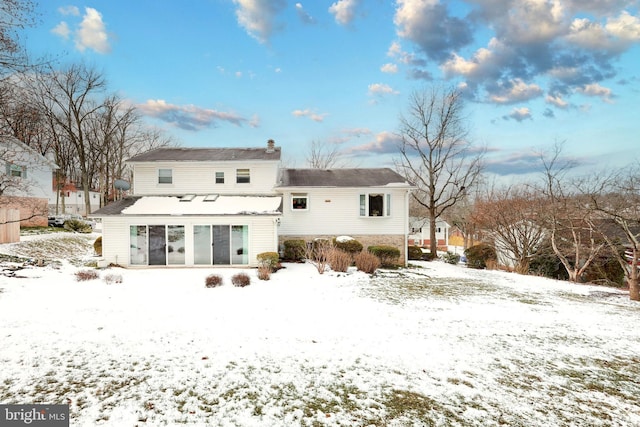 view of snow covered house