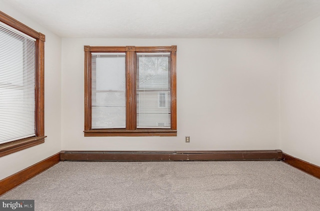 unfurnished room with carpet flooring