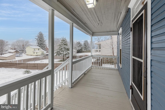 view of snow covered deck