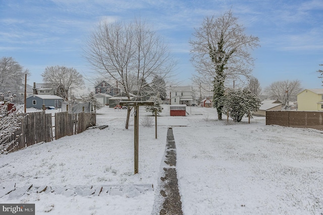 view of yard layered in snow