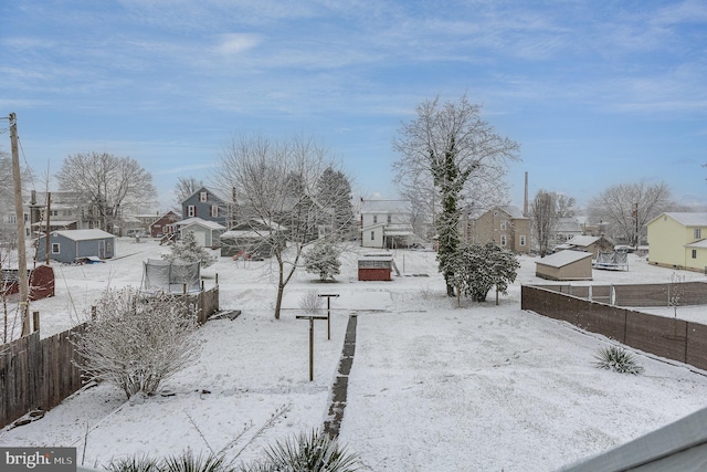 view of yard covered in snow