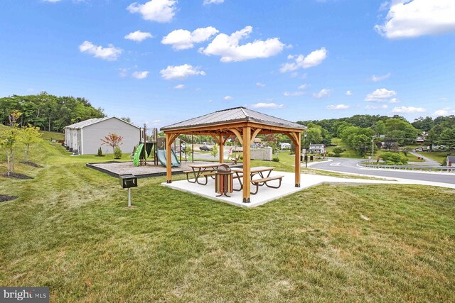 surrounding community with a gazebo and a lawn