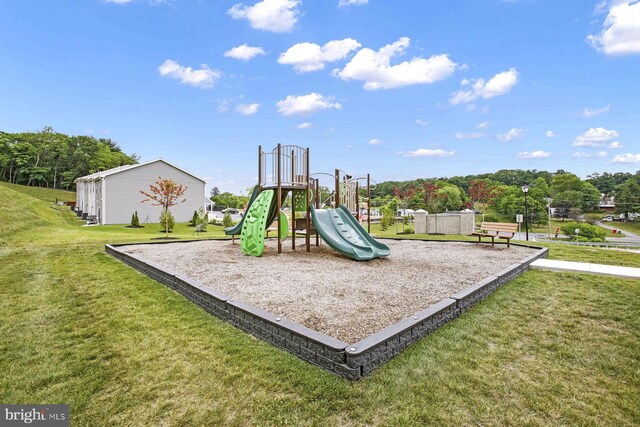 view of play area featuring a lawn