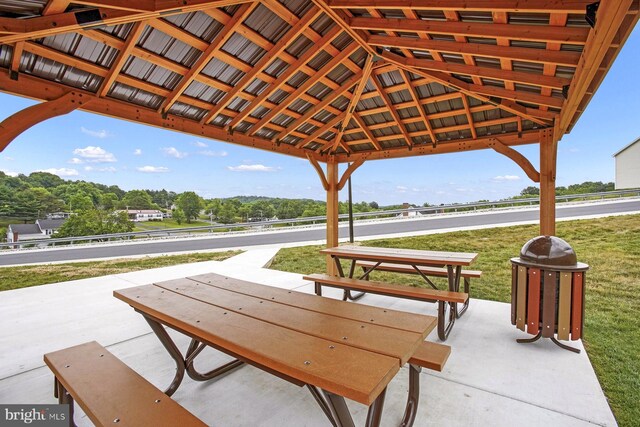 surrounding community with a gazebo and a lawn