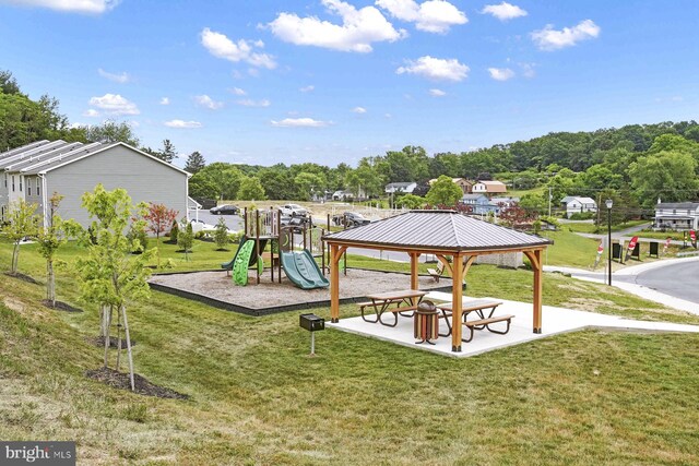 view of play area featuring a lawn