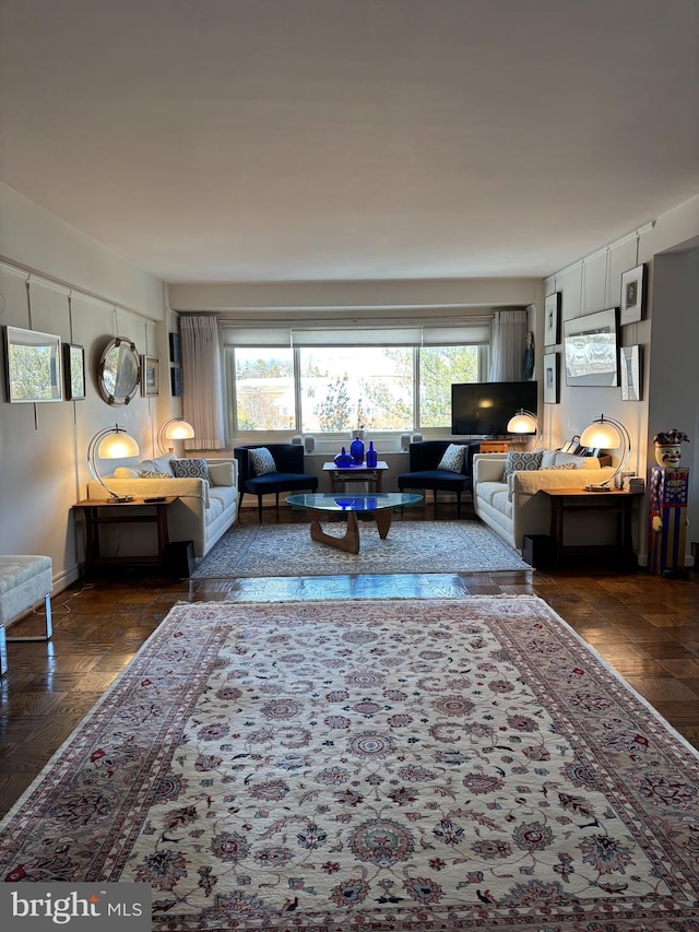 living room with dark parquet floors