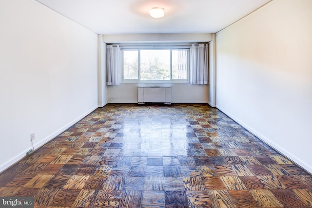 empty room featuring radiator heating unit