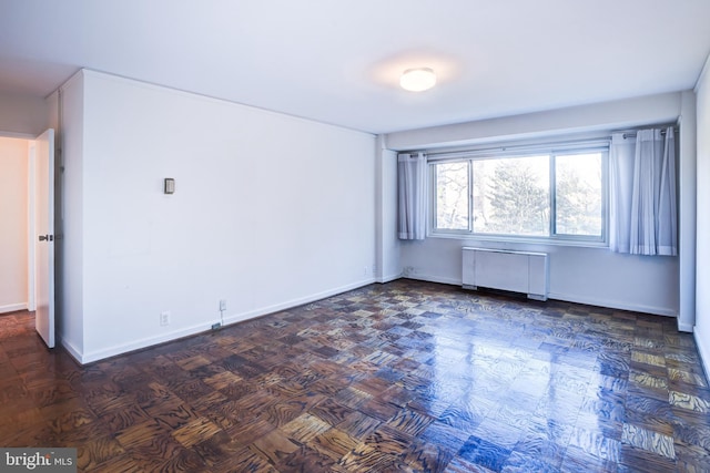 unfurnished room with radiator