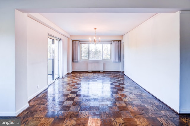 unfurnished dining area featuring radiator heating unit, dark parquet floors, and a chandelier