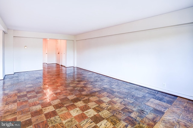 spare room with parquet floors