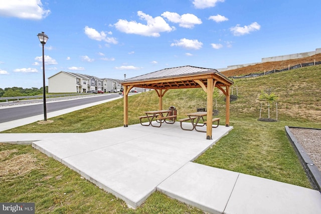 view of community featuring a gazebo and a yard