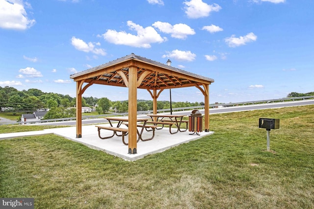 surrounding community featuring a gazebo and a lawn