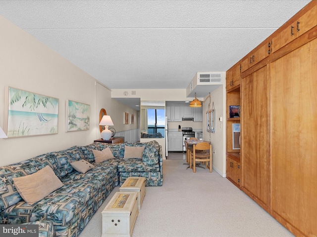 living room featuring a textured ceiling, light colored carpet, and wooden walls