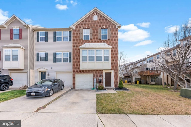 view of property with a garage and a front lawn