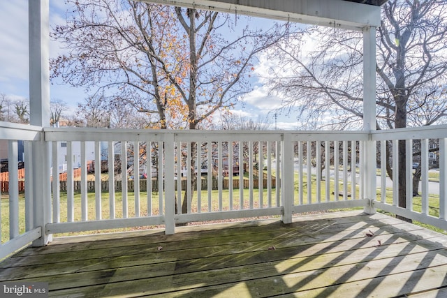 wooden terrace with a yard