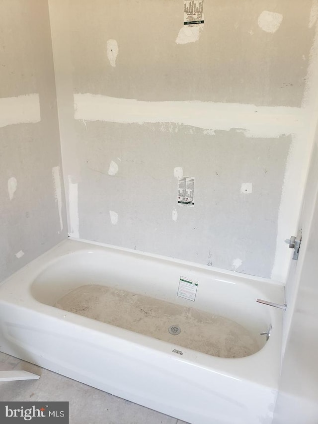 bathroom featuring a tub to relax in