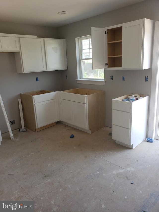 kitchen featuring white cabinets