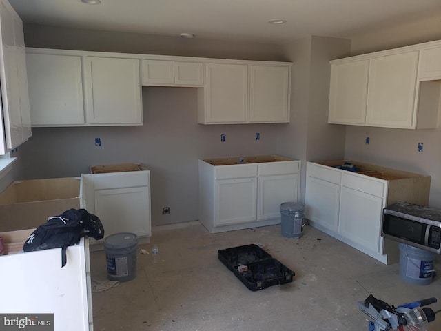 kitchen featuring white cabinetry