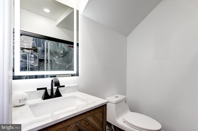 1324 Aisquith St, Baltimore, MD 21202 - bathroom with toilet, vanity, and lofted ceiling