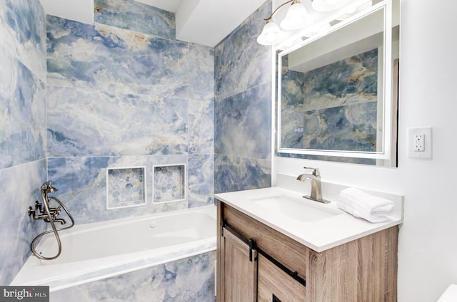 1324 Aisquith St, Baltimore, MD 21202 - bathroom featuring vanity, a bath, and tile walls