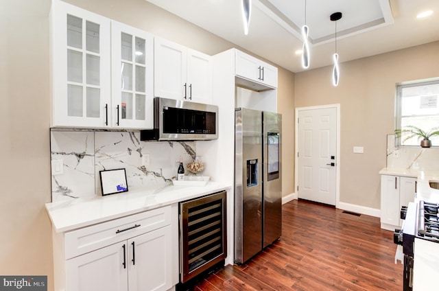 1324 Aisquith St, Baltimore, MD 21202 - kitchen featuring stainless steel appliances, wine cooler, tasteful backsplash, glass insert cabinets, and recessed lighting