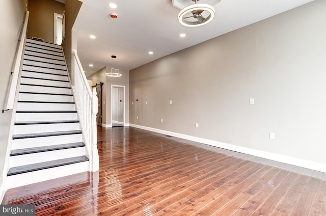 1324 Aisquith St, Baltimore, MD 21202 - unfurnished living room with baseboards, wood finished floors, recessed lighting, and stairs