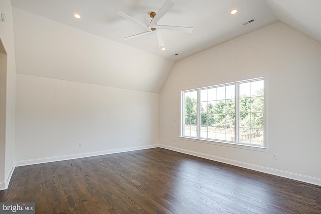 bonus room featuring ceiling fan, dark wood-type flooring, and lofted ceiling