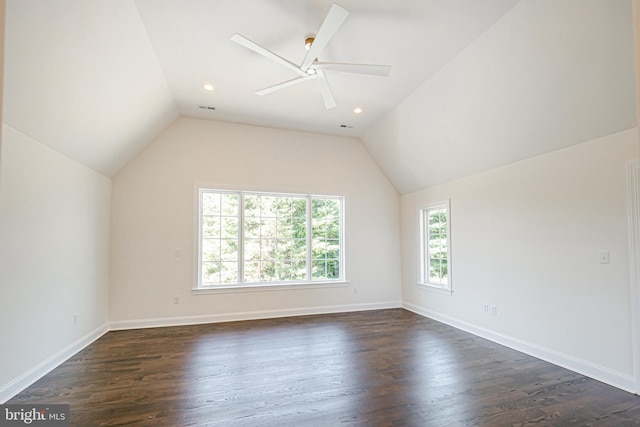 additional living space featuring dark hardwood / wood-style floors, ceiling fan, and vaulted ceiling