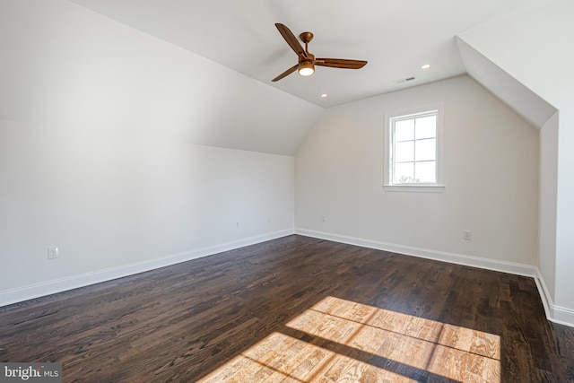 bonus room with ceiling fan, dark hardwood / wood-style flooring, and vaulted ceiling