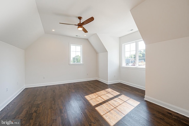 additional living space featuring ceiling fan, dark hardwood / wood-style flooring, and vaulted ceiling