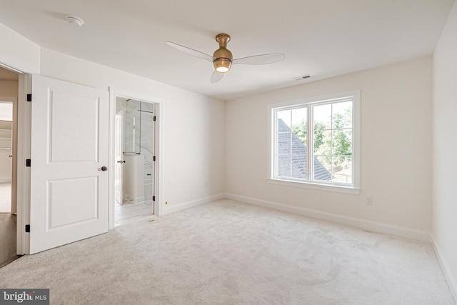 carpeted empty room with ceiling fan