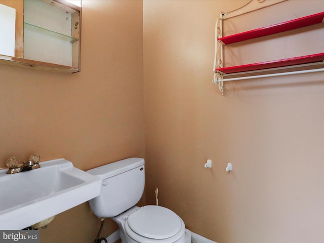 bathroom with toilet and sink