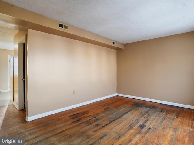 empty room with dark hardwood / wood-style floors