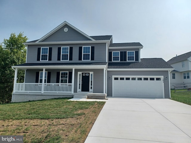 view of front of property featuring driveway, a porch, and a front yard