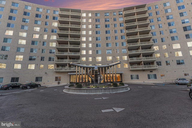 view of outdoor building at dusk