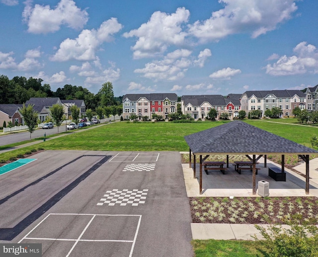 view of property's community with a gazebo and a yard